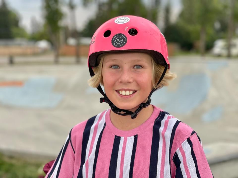 11-year-old Dex Foster in his signature pink helmet at his home town skatepark in Carstairs.