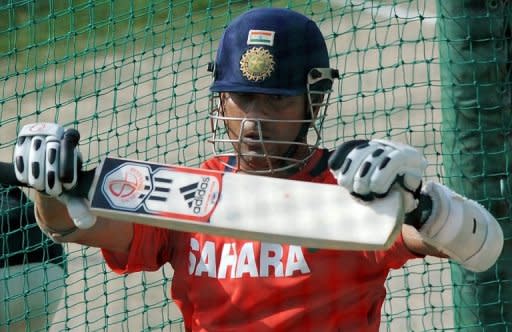 Indian batsman Sachin Tendulkar holds his bat during a training session at the Punjab Cricket Association (PCA) Stadium in Mohali. With their World Cup semi-final hailed as a diplomatic game-changer, as well as the mother of all cricket battles, India and Pakistan were just desperate to get the game underway