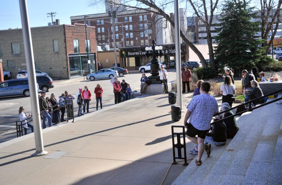 A group of pro-choice advocates gather Tuesday, May 3, 2022, outside the Stearns County Court House in St. Cloud.