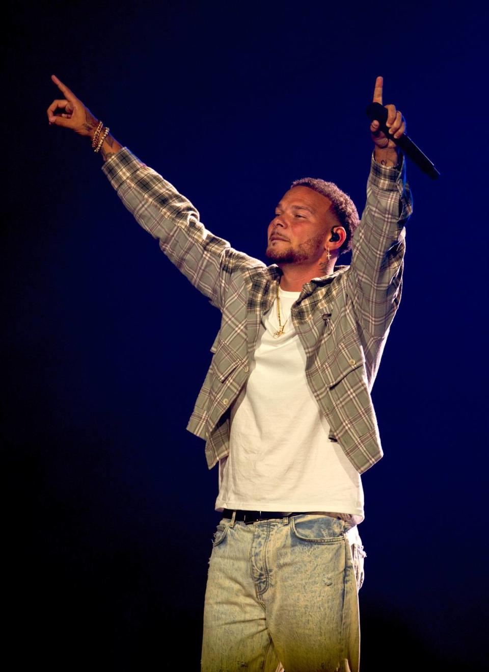 Kane Brown acknowledges the crowd as he brings his “In The Air Tour” to Raleigh, N.C.’s PNC Arena, Friday night, June 7, 2024.