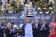 Casper Ruud of Norway lifts the trophy after defeating Stefanos Tsitsipas of Greece, right, 7-5, 6-3 during the final of the Barcelona Open tennis tournament in Barcelona, Spain, Sunday, April 21, 2024. (AP Photo/Joan Monfort)