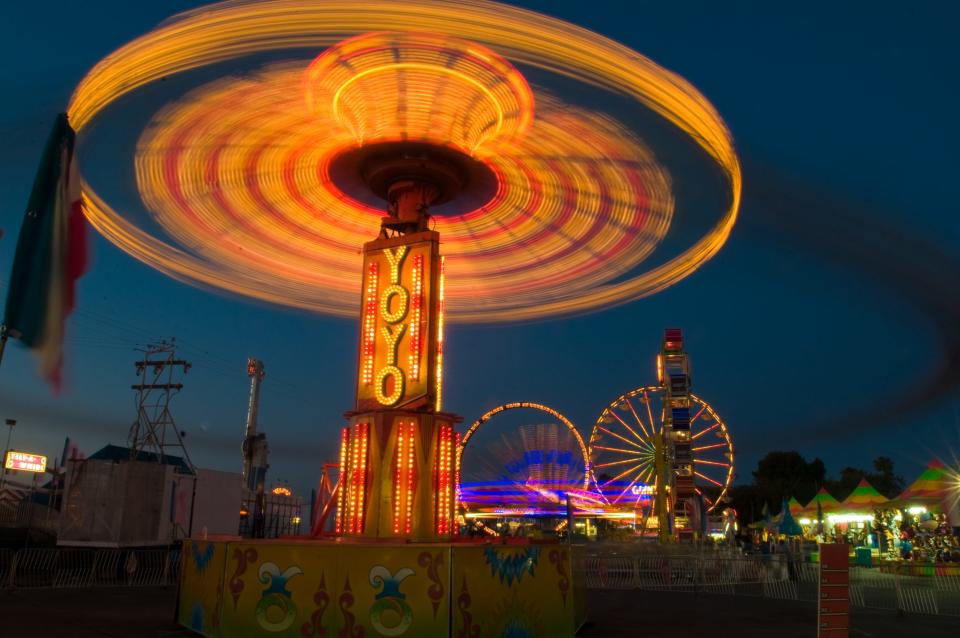 (6/24/09)The YoYo ride is a blur at night on the carnival midway at the San Joaquin County Fair in Stockton. Shot with an exposure of 5 seconds. CLIFFORD OTO/THE STOCKTON RECORD