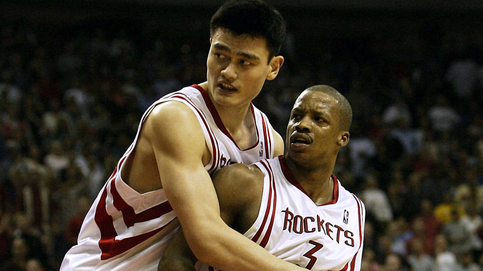 Yao Ming holds back Rockets teammate Steve Francis (Getty Images).