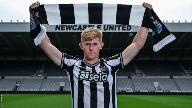 Chelsea defender Lewis Hall holds up Newcastle scarf