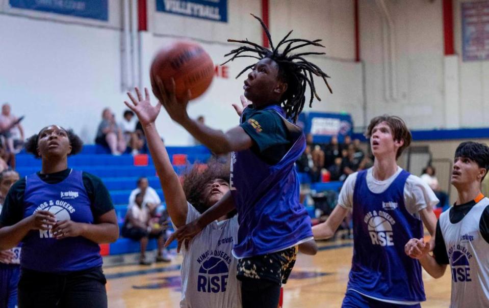 Tristin Murry goes up for a basket while playing a game on July 8 in the Kings and Queens Rise program.