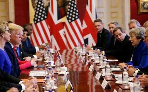 Donald Trump and Theresa May sit at the centre of the table - Credit: Tim Ireland/AP