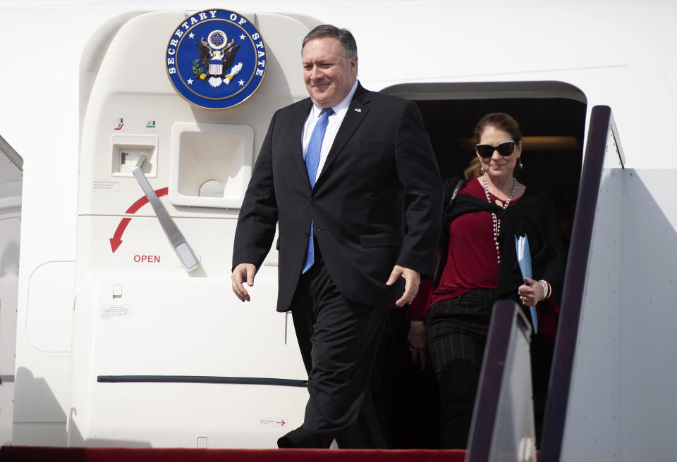 U.S. Secretary of State Mike Pompeo and his wife, Susan arrive to Abu Dhabi International Airport in the United Arab Emirates, Sunday, Jan. 13, 2019. (Andrew Caballero-Reynolds/Pool via AP)