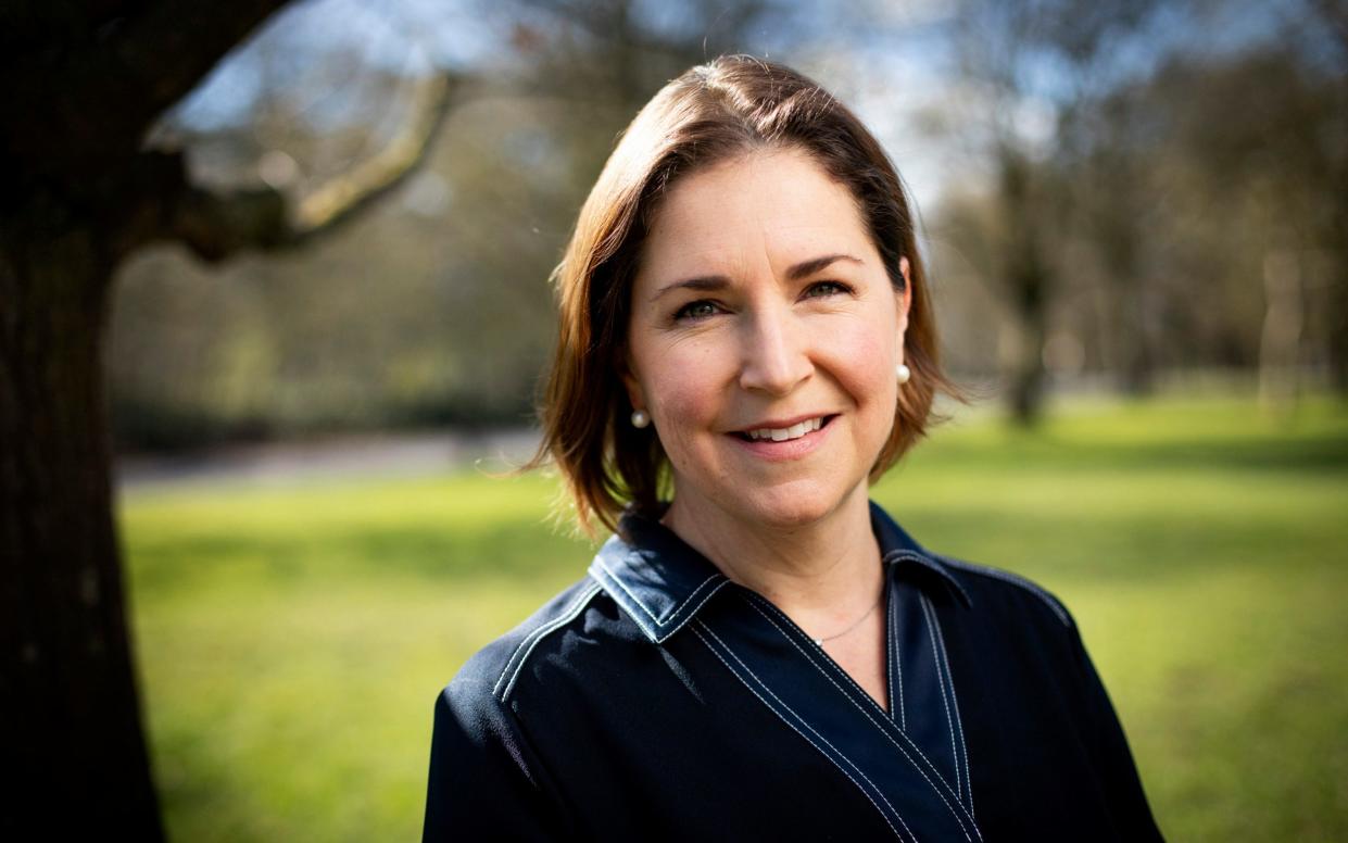 A portrait of Ms Jacobs in a park