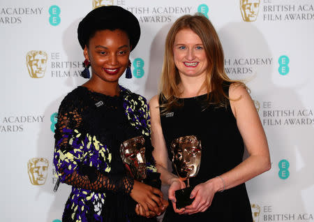 Rungano Nyoni and Emily Morgan hold their awards for an Outstanding Debut by A British Writer, Director or Producer for 'I Am Not A Witch at the British Academy of Film and Television Awards (BAFTA) at the Royal Albert Hall in London, Britain February 18, 2018. REUTERS/Hannah McKay