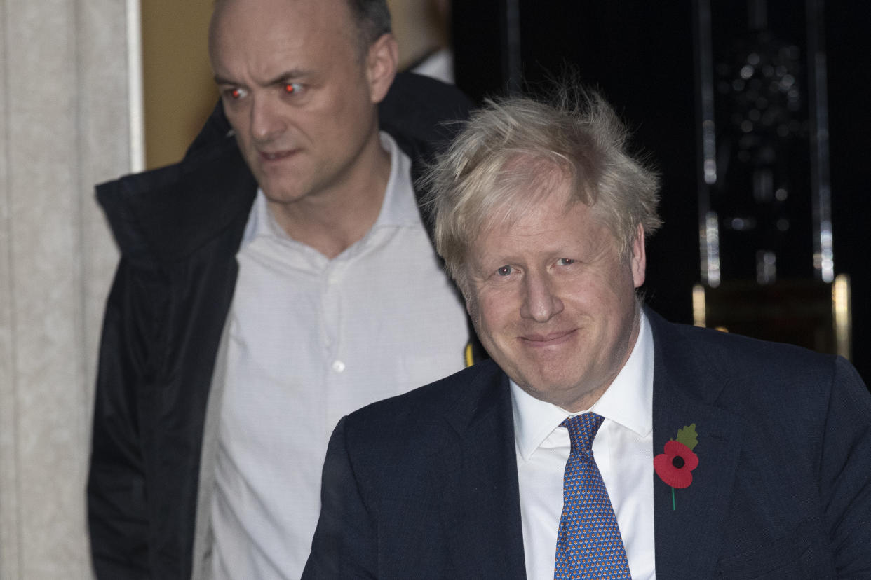 British Prime Minister Boris Johnson and his advisor Dominic Cummings, left, leave 10 Downing Street in London, and get in a car together to go to the Houses of Parliament, Monday, Oct. 28, 2019. British Prime Minister Boris Johnson says it's Parliament's fault, not his, that Britain will not be leaving the European Union as scheduled on Oct. 31. The EU has agreed to postpone Brexit until Jan. 31, 2020, after Johnson failed to get British lawmakers to ratify his divorce deal with the bloc in time to leave this week. (AP Photo/Matt Dunham)