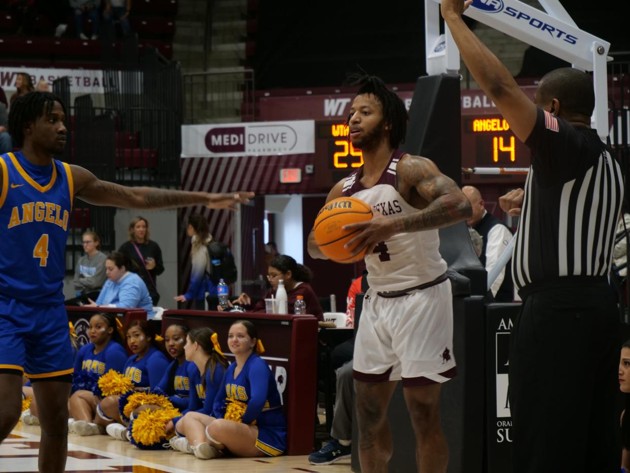 WT's Julius Brown inbounds a pass during a game against Angelo State on Saturday, February 4, 2023 at the First United Bank Center in Canyon.