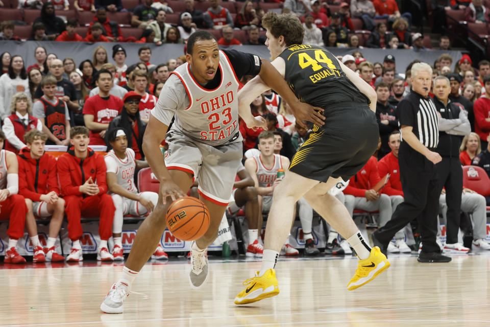 Ohio State's Zed Key, left, drives the baseline past Iowa's Riley Mulvey during the second half of an NCAA college basketball game on Saturday, Jan. 21, 2023, in Columbus, Ohio. (AP Photo/Jay LaPrete)