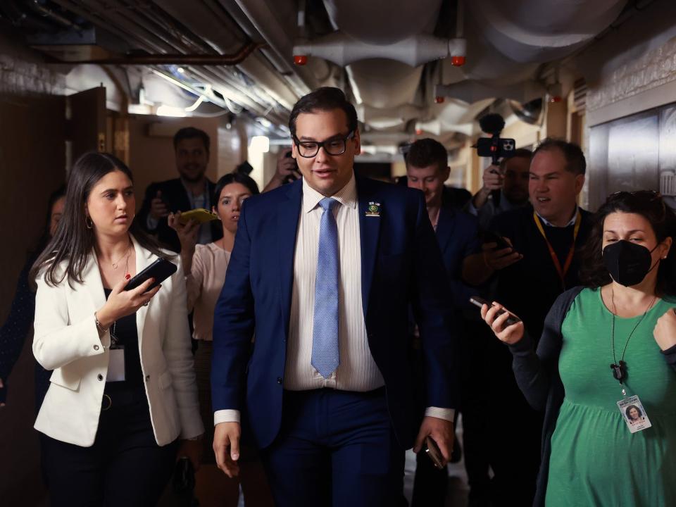 Rep. George Santos outside a House GOP caucus meeting on October 12, 2023.