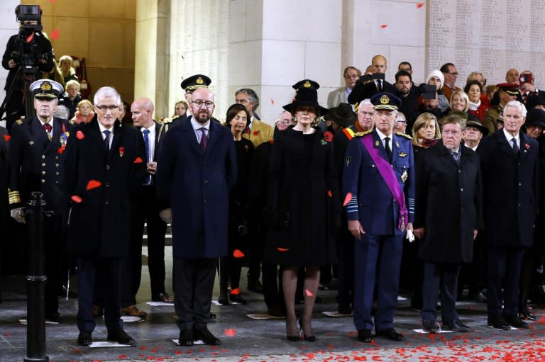 Queen Mathilde of Belgium and King Philippe of Belgium stand during the Last Post ceremony at the Ypres Memorial