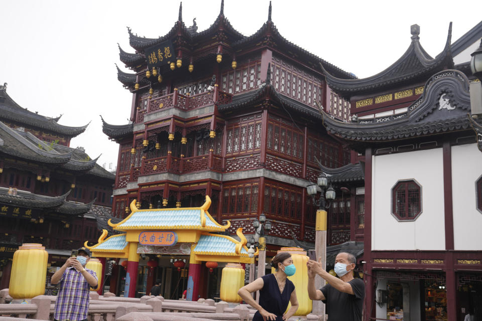 Residents visit the Yu Garden Mall Thursday, June 2, 2022, in Shanghai. Traffic, pedestrians and joggers reappeared on the streets of Shanghai on Wednesday as China's largest city began returning to normalcy amid the easing of a strict two-month COVID-19 lockdown that has drawn unusual protests over its heavy-handed implementation. (AP Photo/Ng Han Guan)