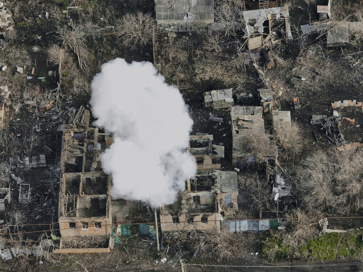 Smoke billows after Russian attacks in the outskirts of Bakhmut, Ukraine, Tuesday, Dec. 27, 2022. (AP Photo/Libkos)