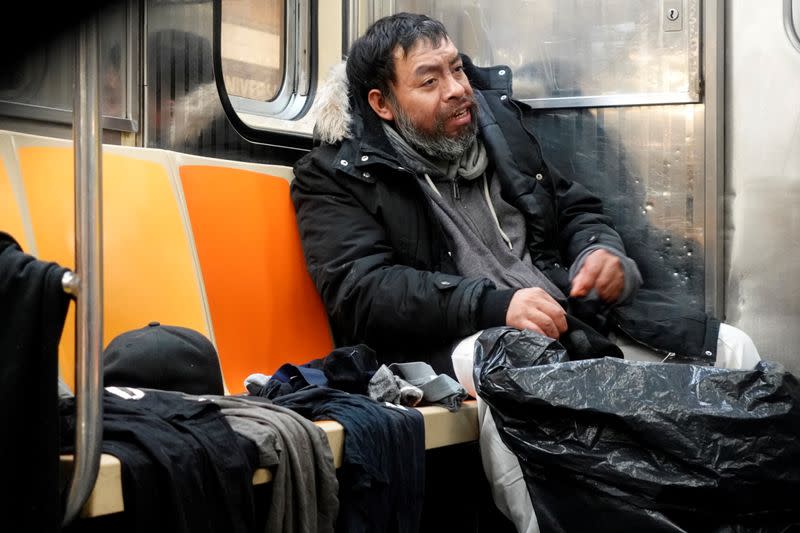 Luis, a man who is living in the New York subway system, repacks his belongings as the outbreak of the coronavirus disease (COVID-19) continues in the subways of New York