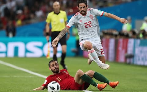 Isco jumps over Bernado Silva's tackle - Credit: TASS / Barcroft Images