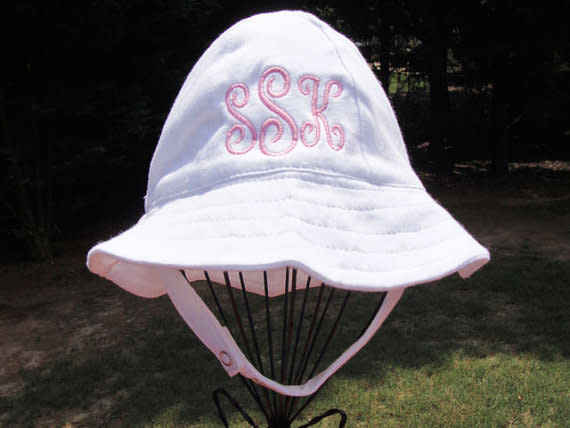 Get it on <a href="https://www.etsy.com/listing/229558795/monogrammed-infant-white-sun-hat?ga_order=most_relevant&amp;ga_search_type=all&amp;ga_view_type=gallery&amp;ga_search_query=sun%20hats%20for%20babies&amp;ref=sr_gallery-1-19" target="_blank">Etsy</a>, $19.