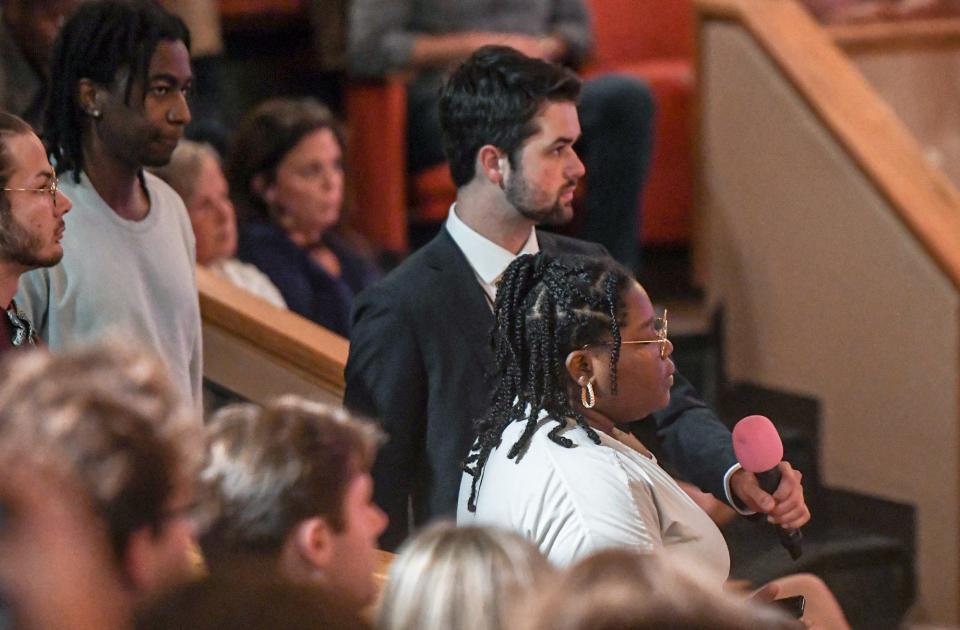 Jasmine Cuffy of Anderson asks about comparison of slavery to modern day education to guest speaker Candace Owens at the Turning Point USA at Clemson University event titled "All Lives Matter" in Memorial Auditorium in Clemson Tuesday, April 4, 2023.