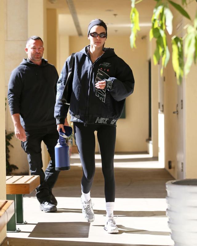 Kendall Jenner sports a hoodie and leggings as she braves the rain
