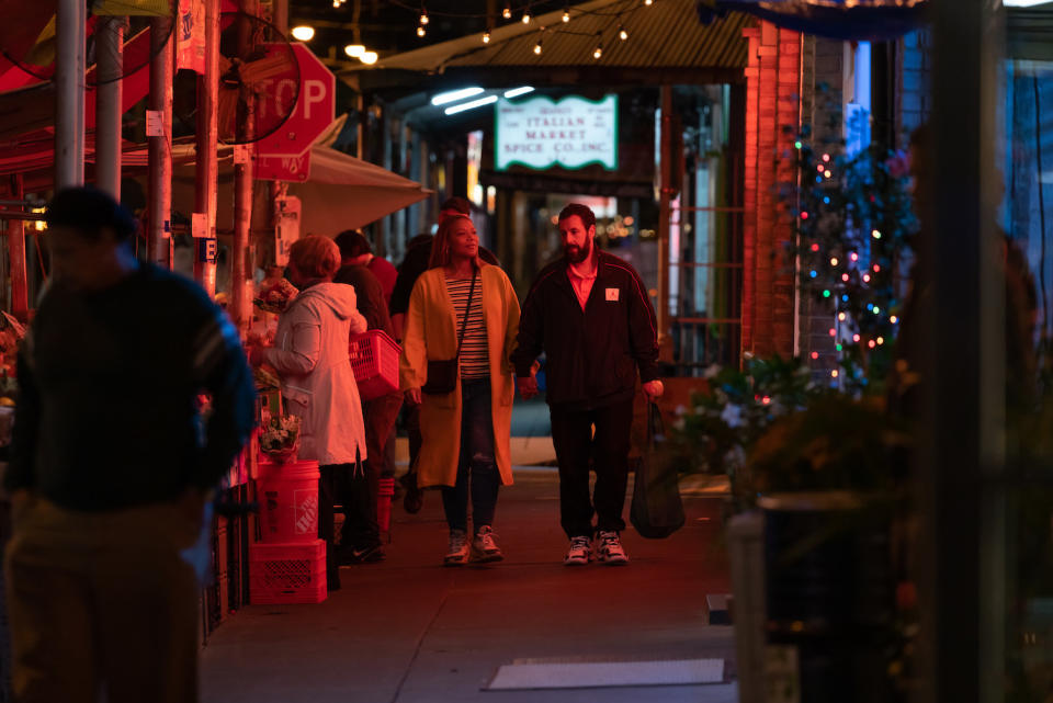 Adam Sandler and Queen Latifah's characters walking down the street