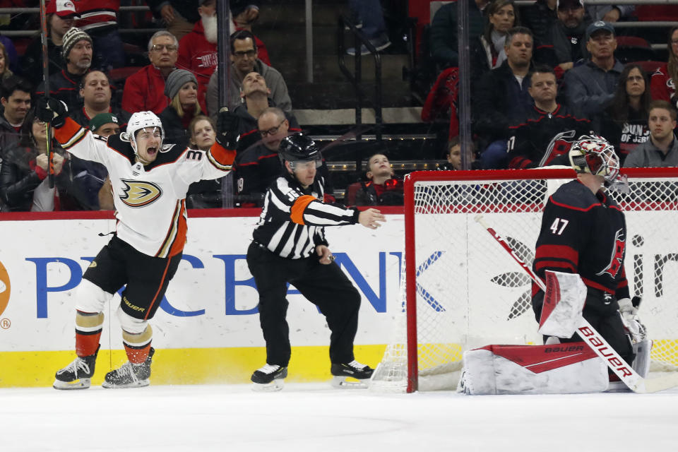 Anaheim Ducks center Sam Steel (34) celebrates his overtime goal against Carolina Hurricanes goaltender James Reimer (47) in an NHL hockey game in Raleigh, N.C., Friday, Jan. 17, 2020. Anaheim won 2-1. (AP Photo/Gerry Broome)