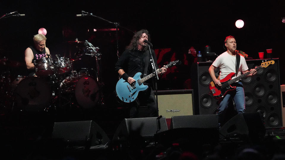 Drummer Josh Freese, lead singer-guitarist Dave Grohl and bassist Nate Mendel of Foo Fighters, the headliners on opening day of Riot Fest.  / Credit: Jake Barlow/CBS News