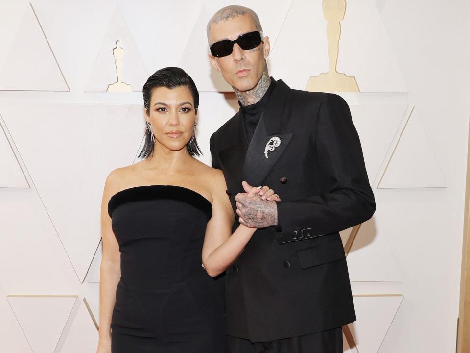 Kourtney Kardashian and Travis Barker at the 2022 Oscars.