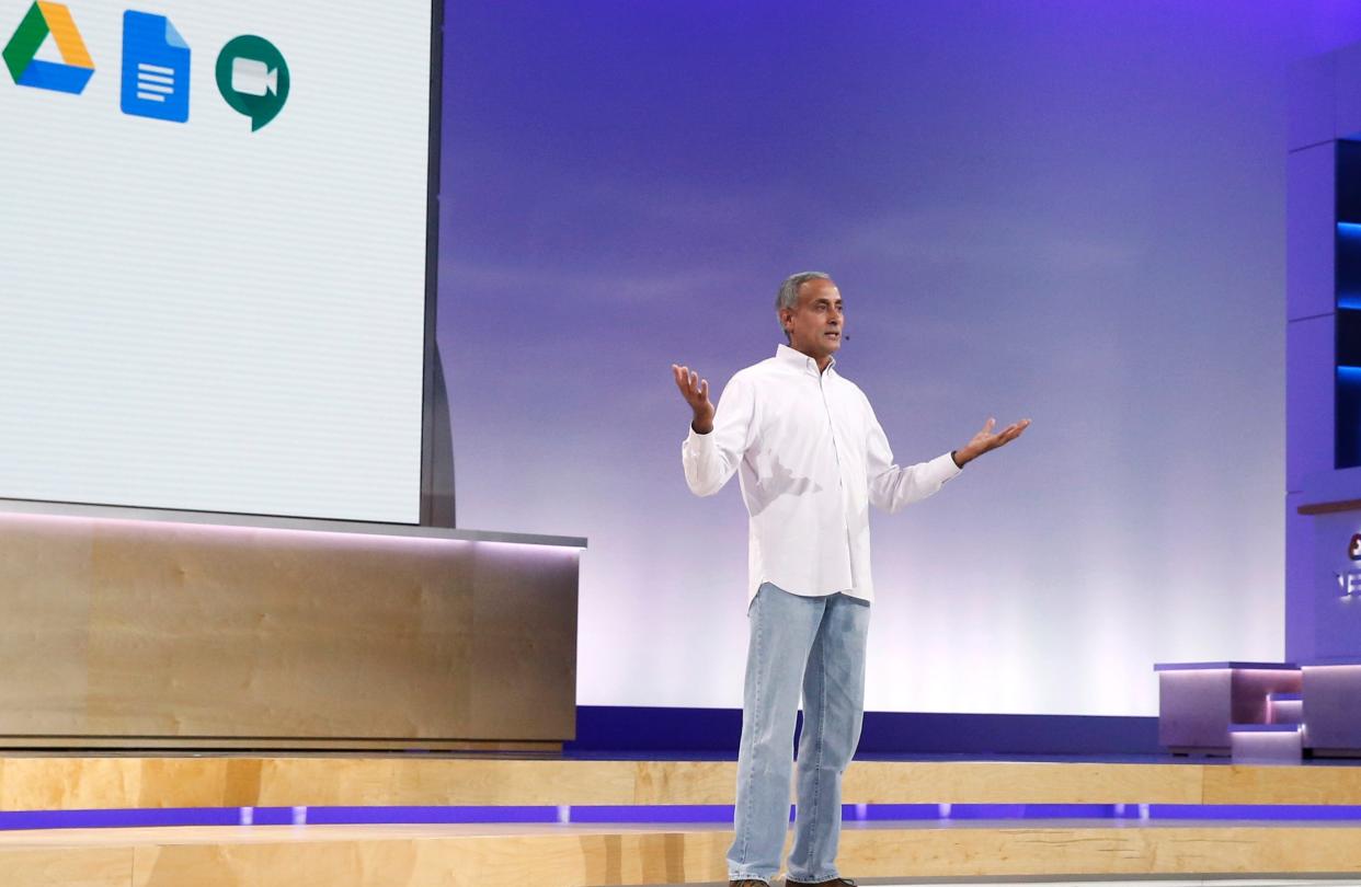 Prabhakar Raghavan  onstage wearing a white shirt and blue jeans