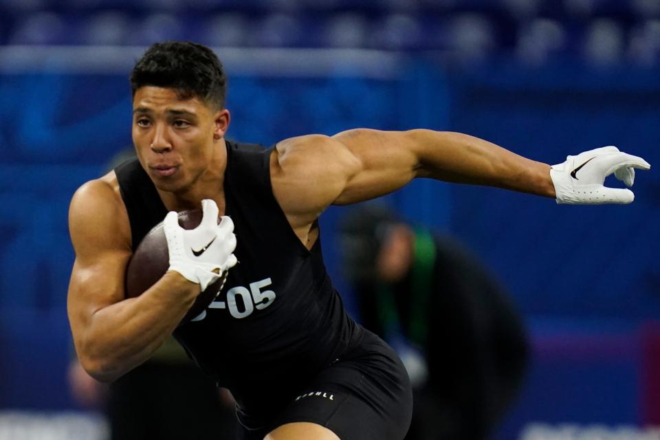 UCLA running back Zach Charbonnet runs a drill at the NFL football scouting combine in Indianapolis, Sunday, March 5, 2023.