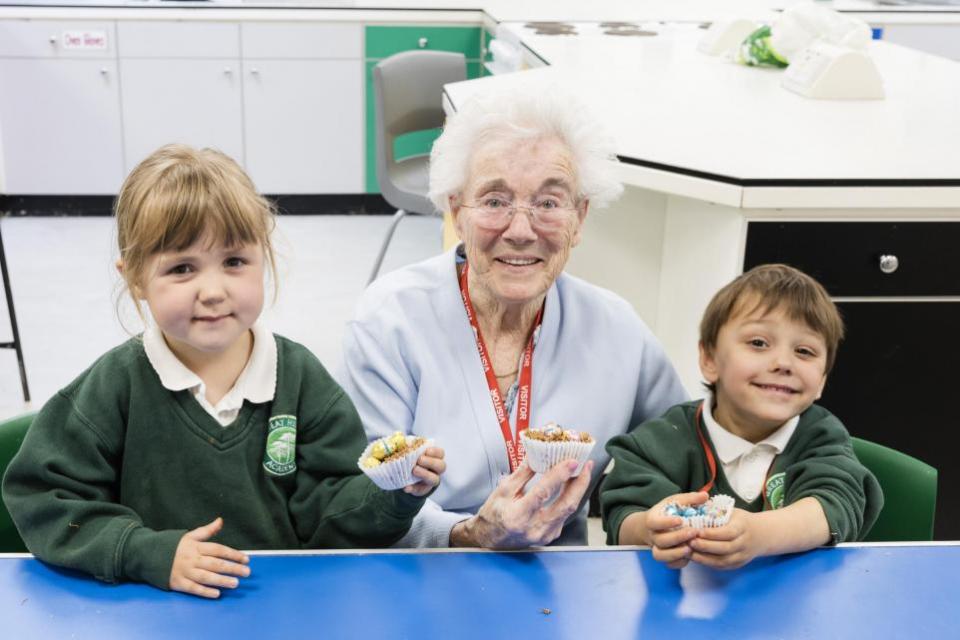East Anglian Daily Times: Mildenhall Lodge Care Home resident Sylvia Lovell with nursery pupils Poppy and Joshua 