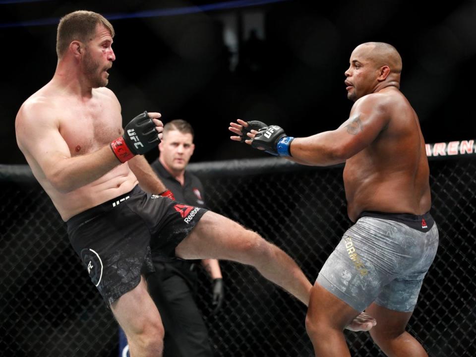 Cormier and Miocic in their first of three clashes, in 2018 (AP)