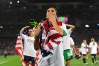 LONDON, ENGLAND - AUGUST 09: Hope Solo #1 of the United States celebrates with the American flag after defeating Japan by a score of 2-1 to win the Women's Football gold medal match on Day 13 of the London 2012 Olympic Games at Wembley Stadium on August 9, 2012 in London, England. (Photo by Michael Regan/Getty Images)