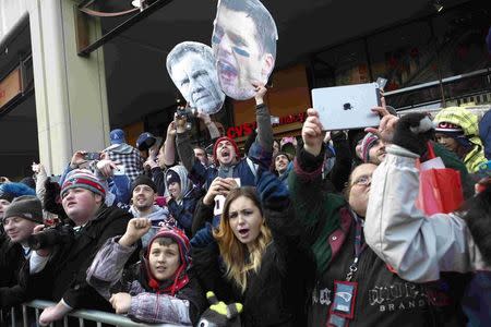 Fans cheer during the New England Patriots Super Bowl XLIX victory parade in Boston, Massachusetts February 4, 2015. REUTERS/Katherine Taylor