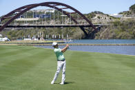 Kevin Kisner hits his second shot on the 13th hole during a second round match at the Dell Technologies Match Play Championship golf tournament Thursday, March 25, 2021, in Austin, Texas. (AP Photo/David J. Phillip)