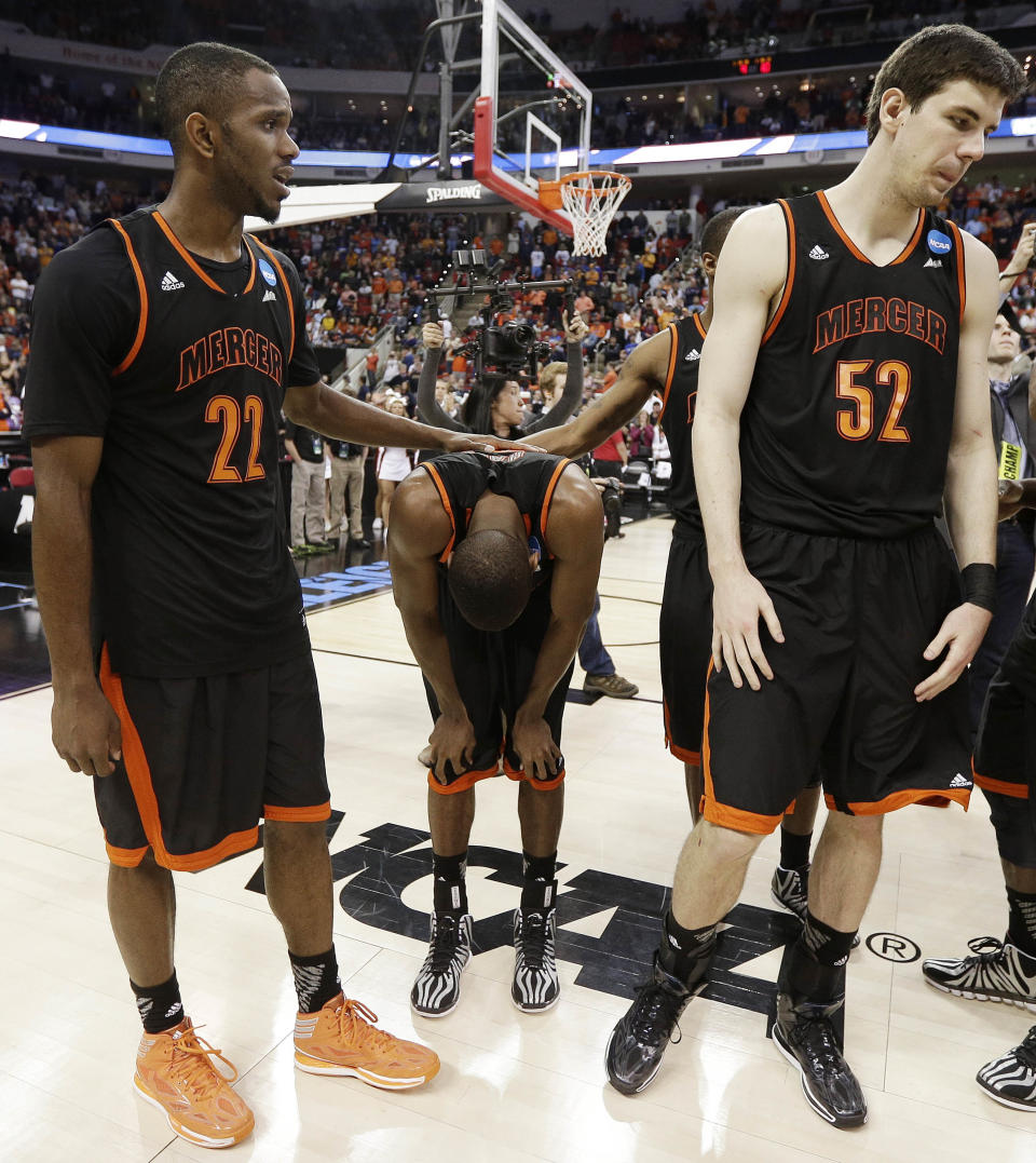Mercer guard Langston Hall, center, stands with his teammates after the second half of an NCAA college basketball third-round tournament game against Tennessee, Sunday, March 23, 2014, in Raleigh. Tennessee Won 83-63. (AP Photo/Chuck Burton)