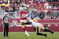 San Francisco 49ers quarterback Jimmy Garoppolo (10) passes against New Orleans Saints defensive end Malcolm Roach during the second half of an NFL football game in Santa Clara, Calif., Sunday, Nov. 27, 2022. (AP Photo/Godofredo A. Vásquez)