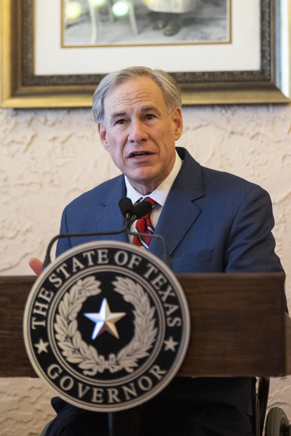 Texas Governor Greg Abbott delivers an announcement in Montelongo's Mexican Restaurant on Tuesday, March 2, 2021, in Lubbock, Texas. Abbott announced that he is rescinding executive orders that limit capacities for businesses and the state wide mask mandate. (AP Photo/Justin Rex)