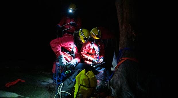 Brolly and Carmichael work on a nighttime ropes training maneuver.