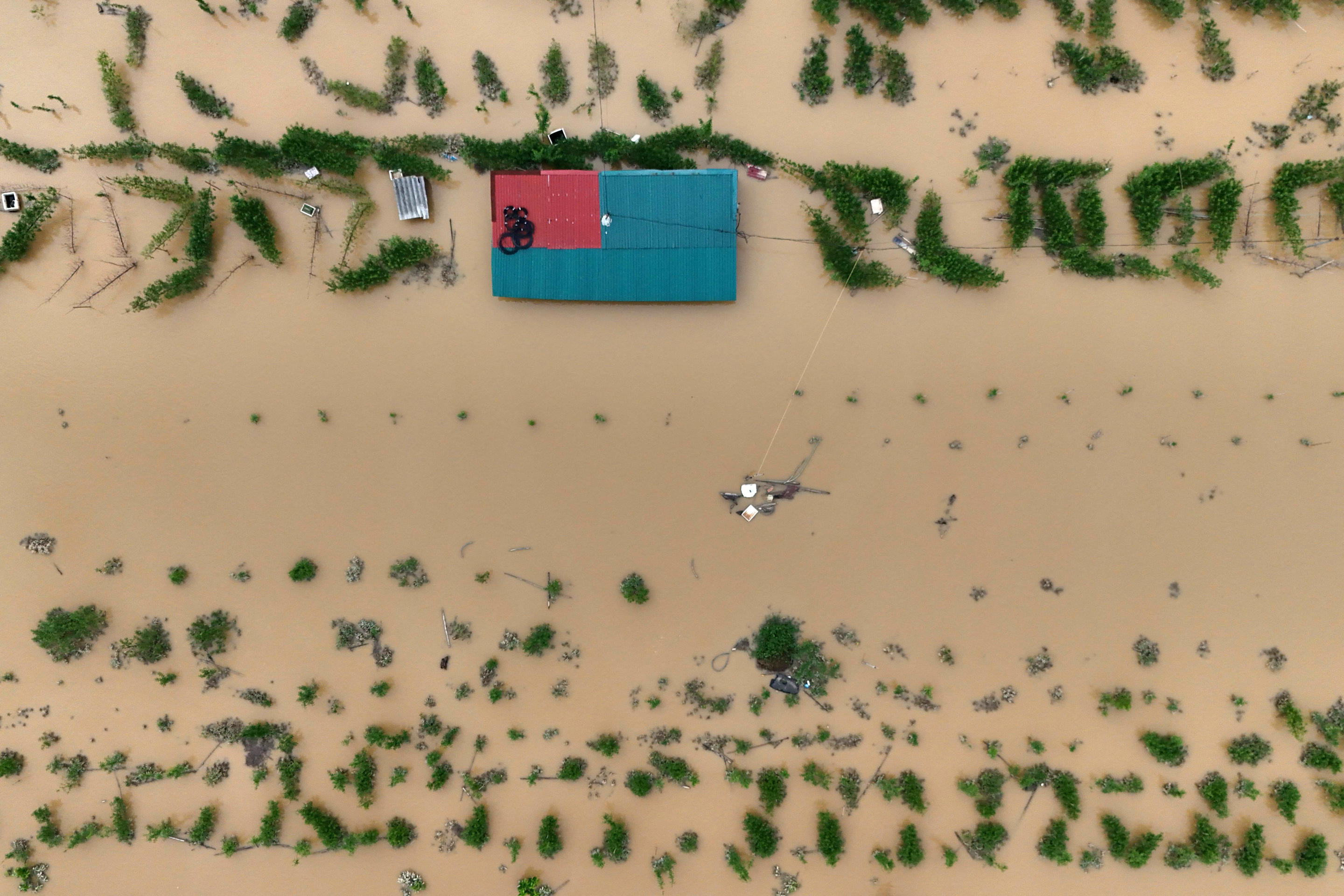 This aerial view shows flooded farms and fields in Hanoi on September 12, 2024. (Nhac Nguyen/AFP via Getty Images)