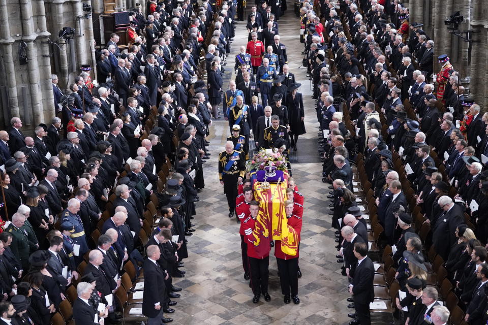 Queen's coffin carried out of Westminster Abbey