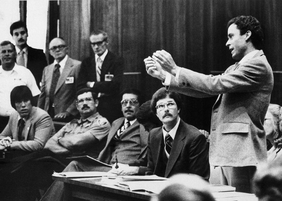 FILE - In this Monday, June 25, 1979 file photo, Ted Bundy presents a motion during his murder trial in Miami. He complained that he could not work on his defense in a 9- by 7-foot cell. Bundy is charged with clubbing two young women to death in a sorority house in Tallahassee. (AP Photo)