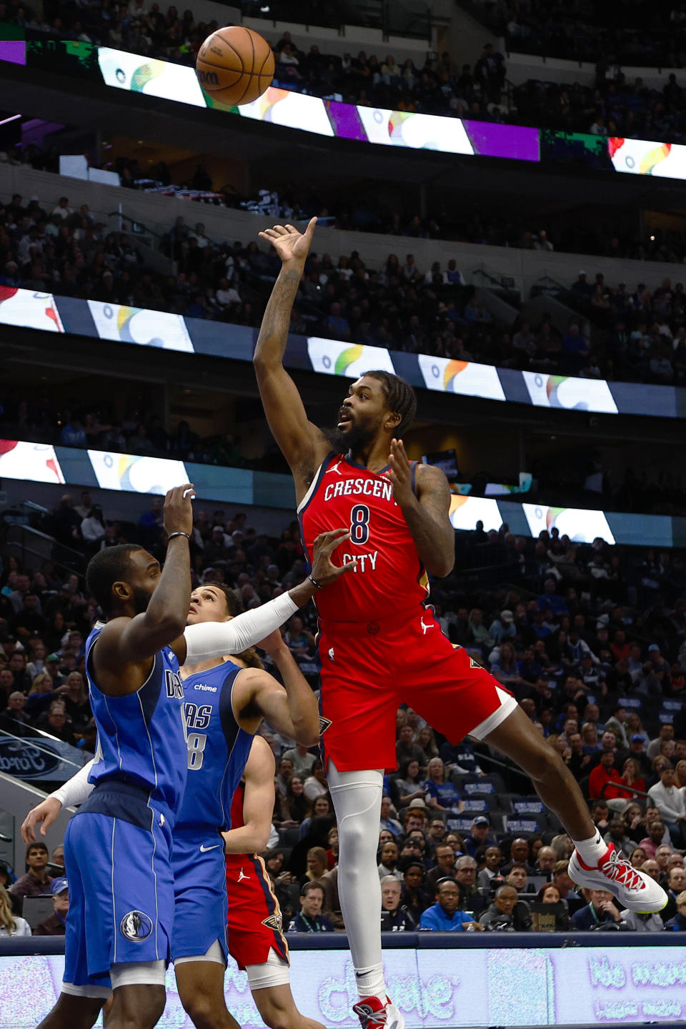 New Orleans Pelicans forward Naji Marshall (8) shoots as Dallas Mavericks forward Tim Hardaway Jr. defends during the first half of an NBA basketball game Saturday, Jan. 13, 2024, in Dallas. (AP Photo/Brandon Wade)