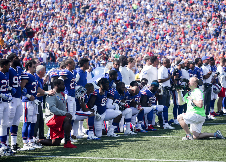 Buffalo Bills players kneel during the American National anthem before an NFL game against the Denver Broncos on September 24, 2017 at New Era Field in Orchard Park, New York. (Photo by Brett Carlsen/Getty Images)