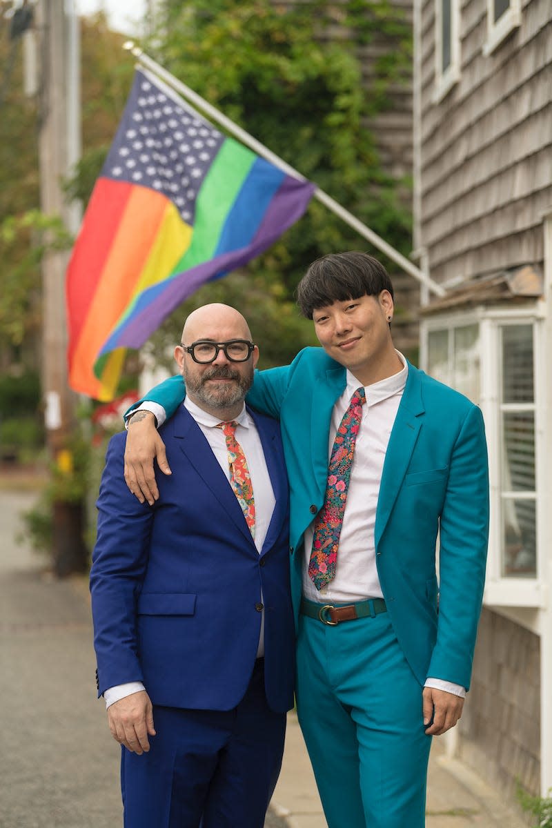 Paul Barnes-Hoggett, left, and his husband Stephen Lim in Provincetown, Mass., in 2021.