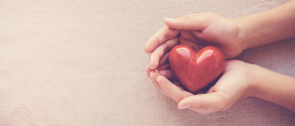 hands holding red heart, health care, love, organ donation, family insurance,CSR,world heart day, world health day, wellbeing, gratitude, be kind,be thankful concept