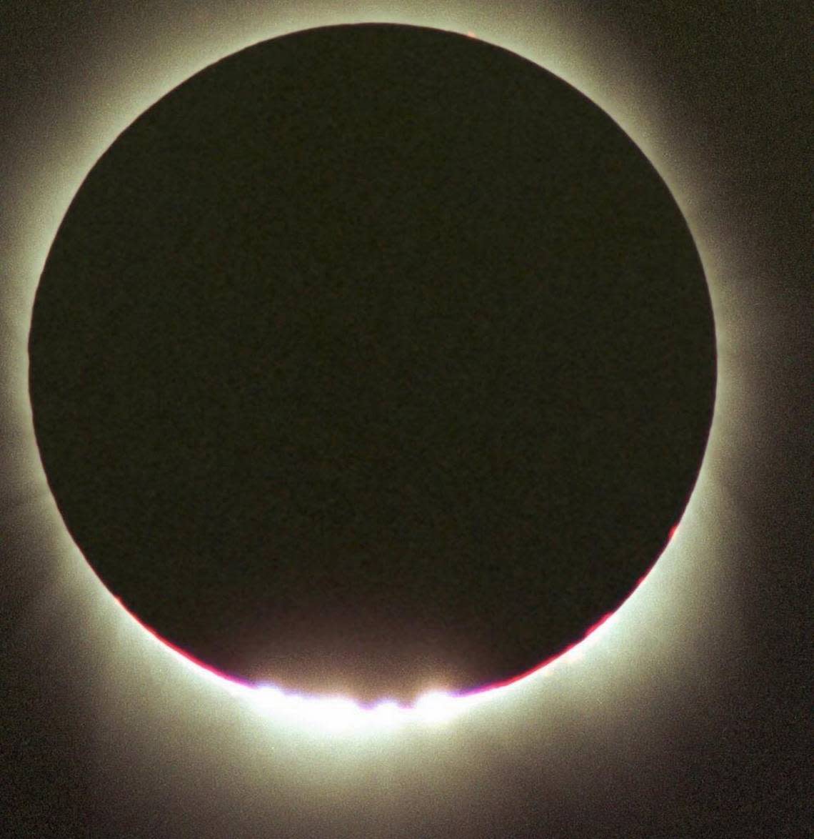 The last glints of sunlight form what are knows as “Baily’s Beads” signaling the end of “totality” during a solar eclipse Feb. 26, 1998 as seen from the deck of the cruise ship off the island of Curacao. Monday’s eclipse is being called “The Great American Eclipse” because it will cross diagonally over the contiguous United States from Oregon to South Carolina. Other countries will see it only as a partial eclipse. JOHNNY HORNE/AP