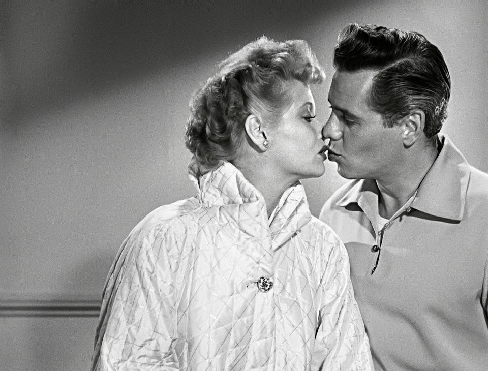 Lucy and Desi kiss in an "I Love Lucy" on set photo