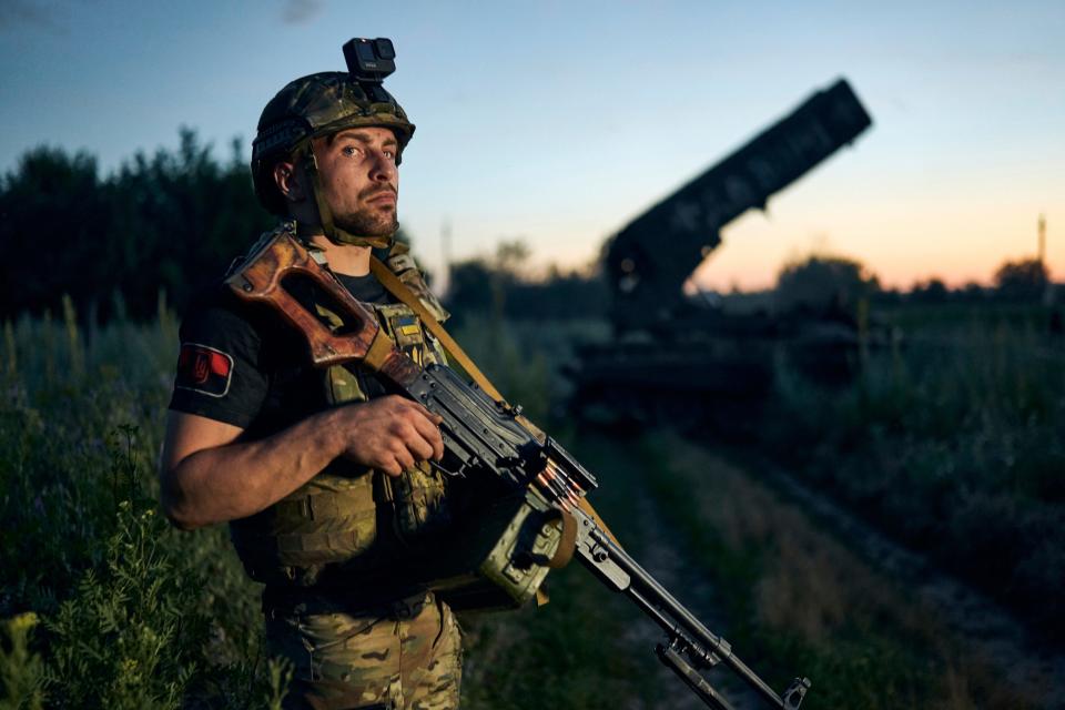 A Ukrainian soldier looks on next to a Russian TOS-1A Solntsepyok rocket launcher, which was captured by the Ukrainian army in Luhansk region on July 7, 2023.